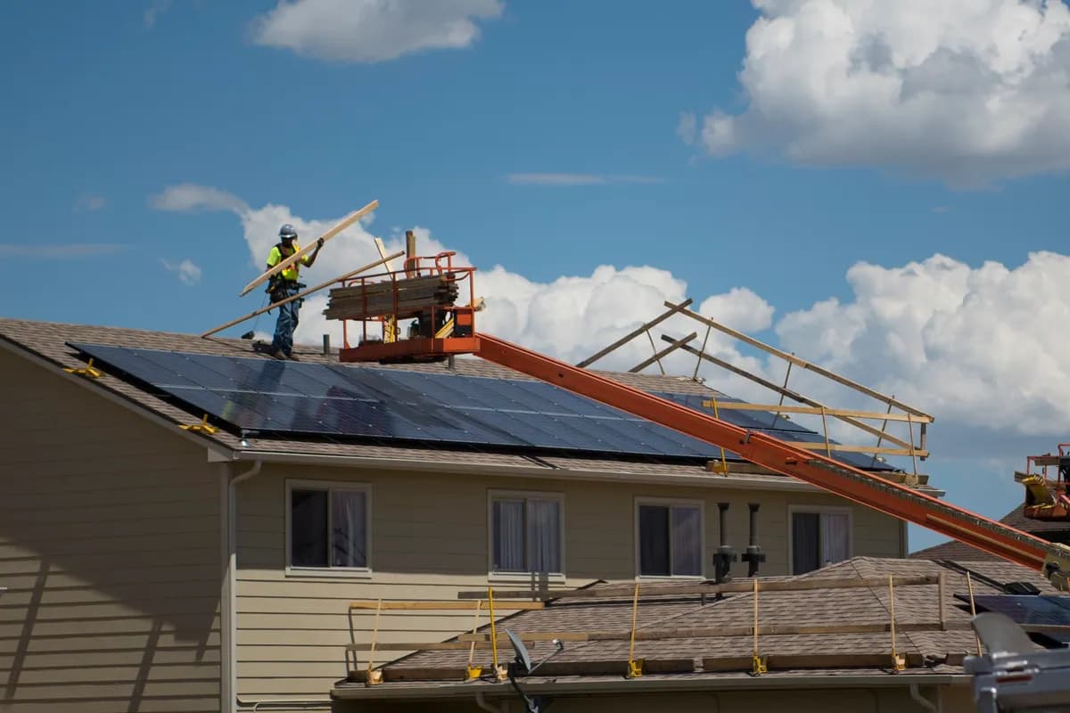 New asphalt shingles being installed on a residential roof